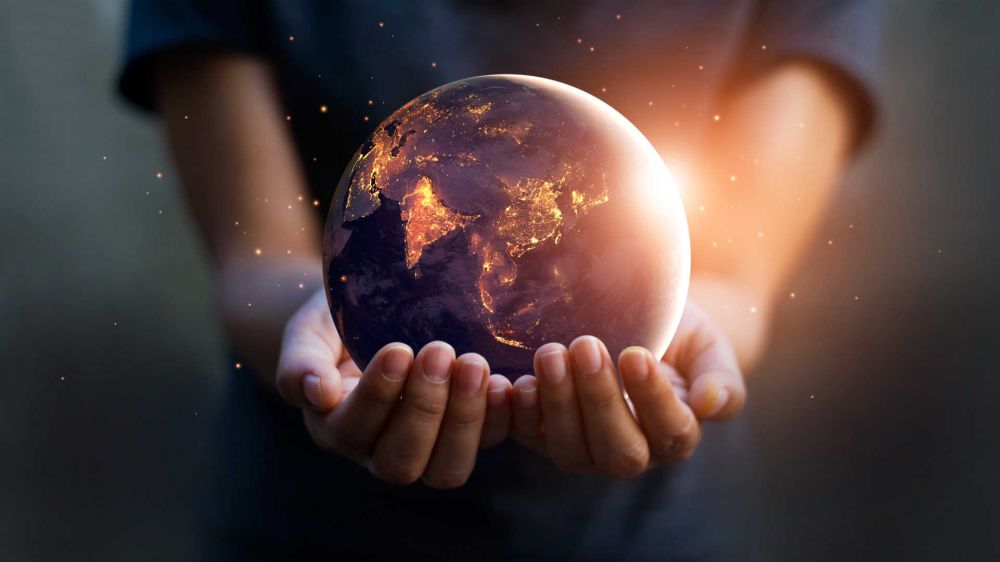 Person holding the world in their hands