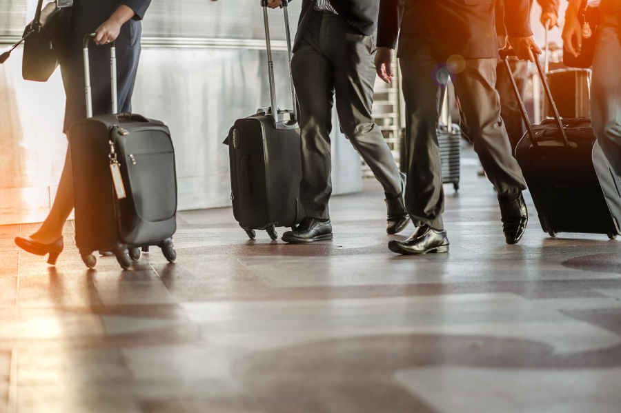 Business travellers with luggage